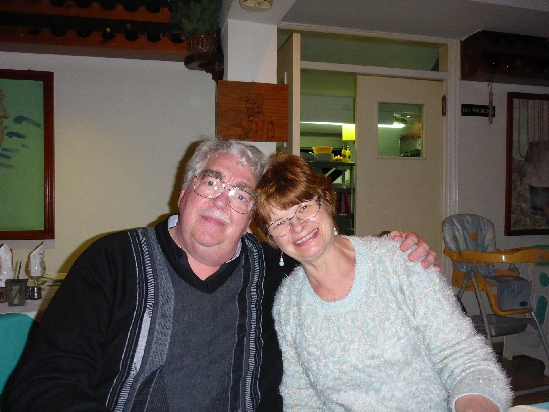 A man and a woman are posing for a picture together