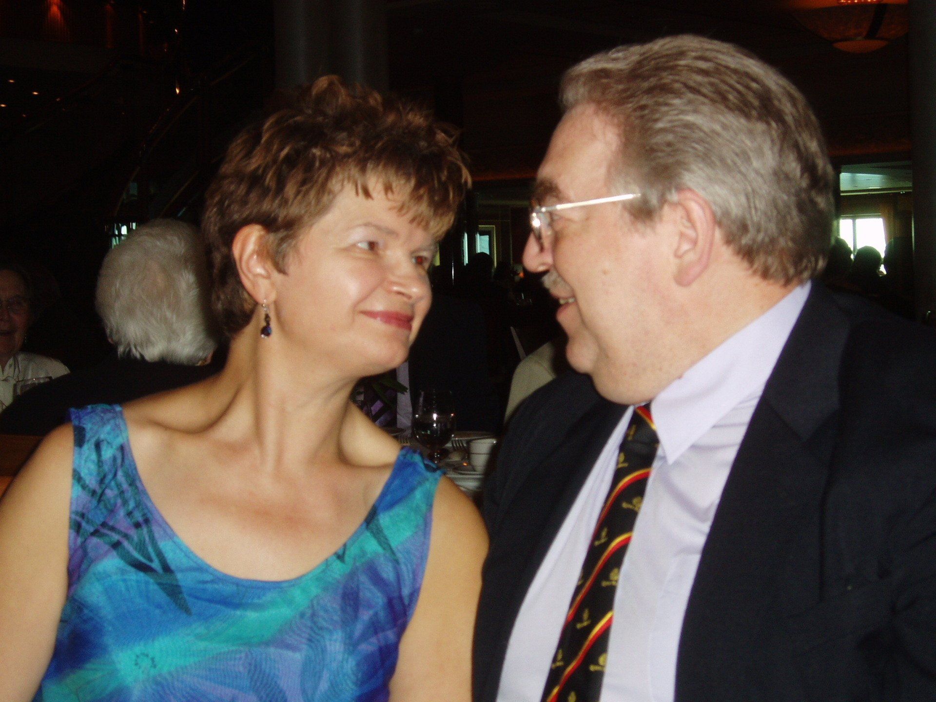 A man and a woman are looking into each other 's eyes