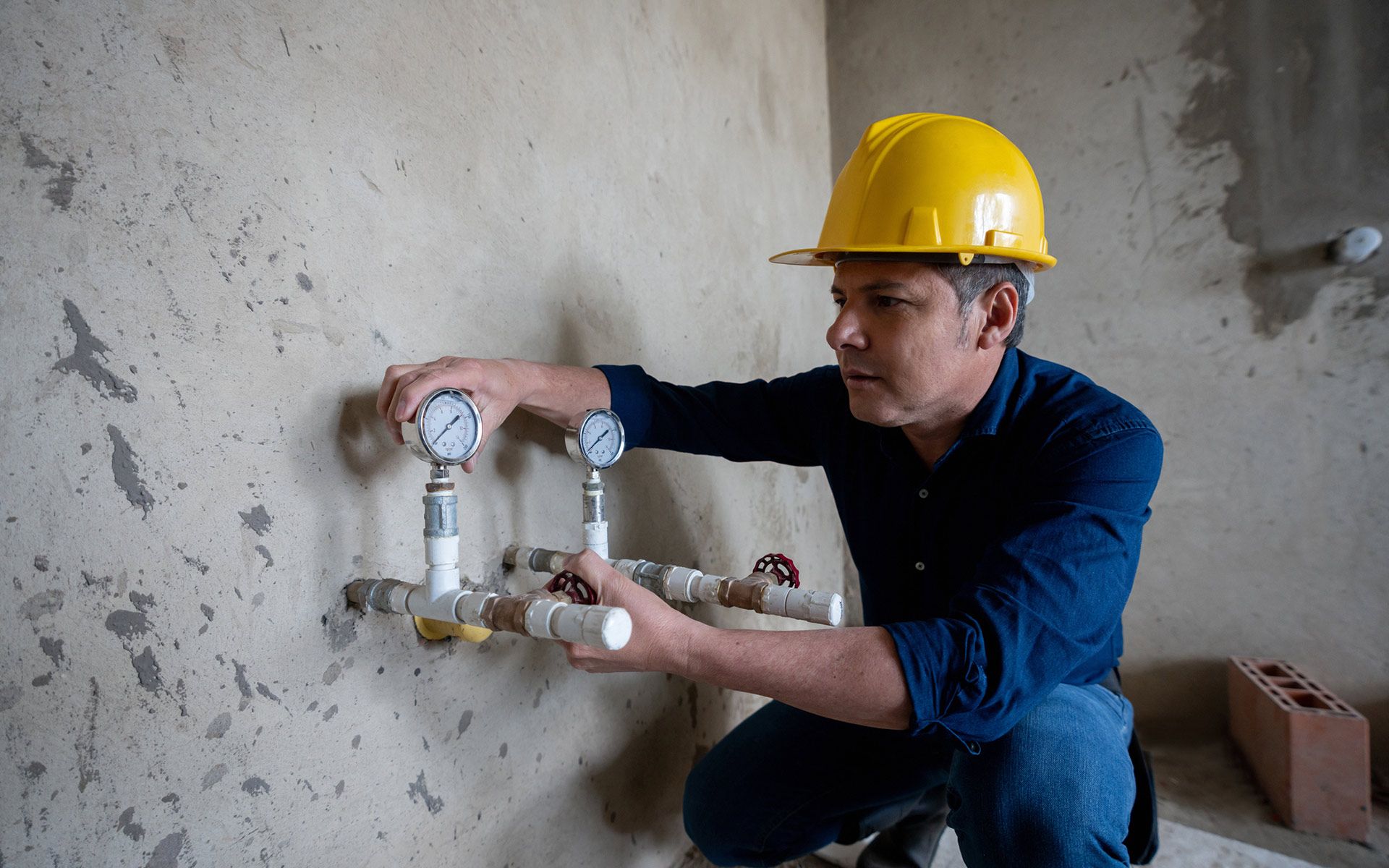 Man Inspecting Gas — Navarre, FL — Navarre Plumbing & Gas