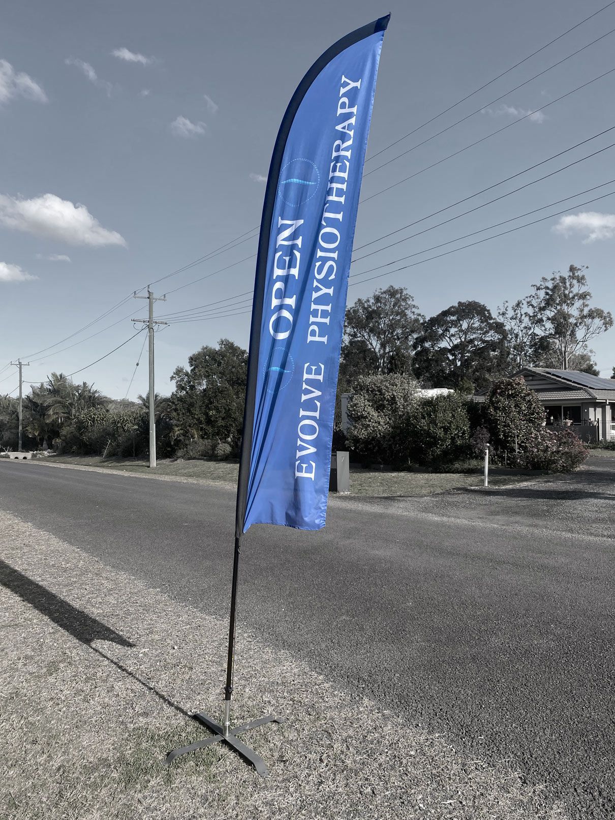 A blue flag with the words open evolve physiotherapy on it