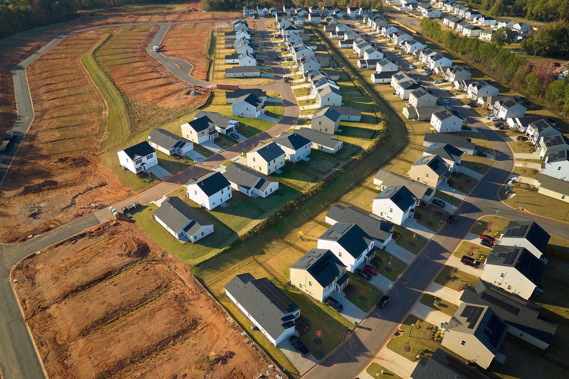 Aerial view of construction site with new tightly packed homes in South Carolina. Family houses as example of real estate development in american suburbs