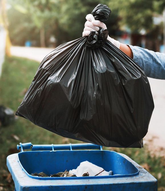 Holding Trash Bag — Colorado Springs, CO — Heritage Trash Service