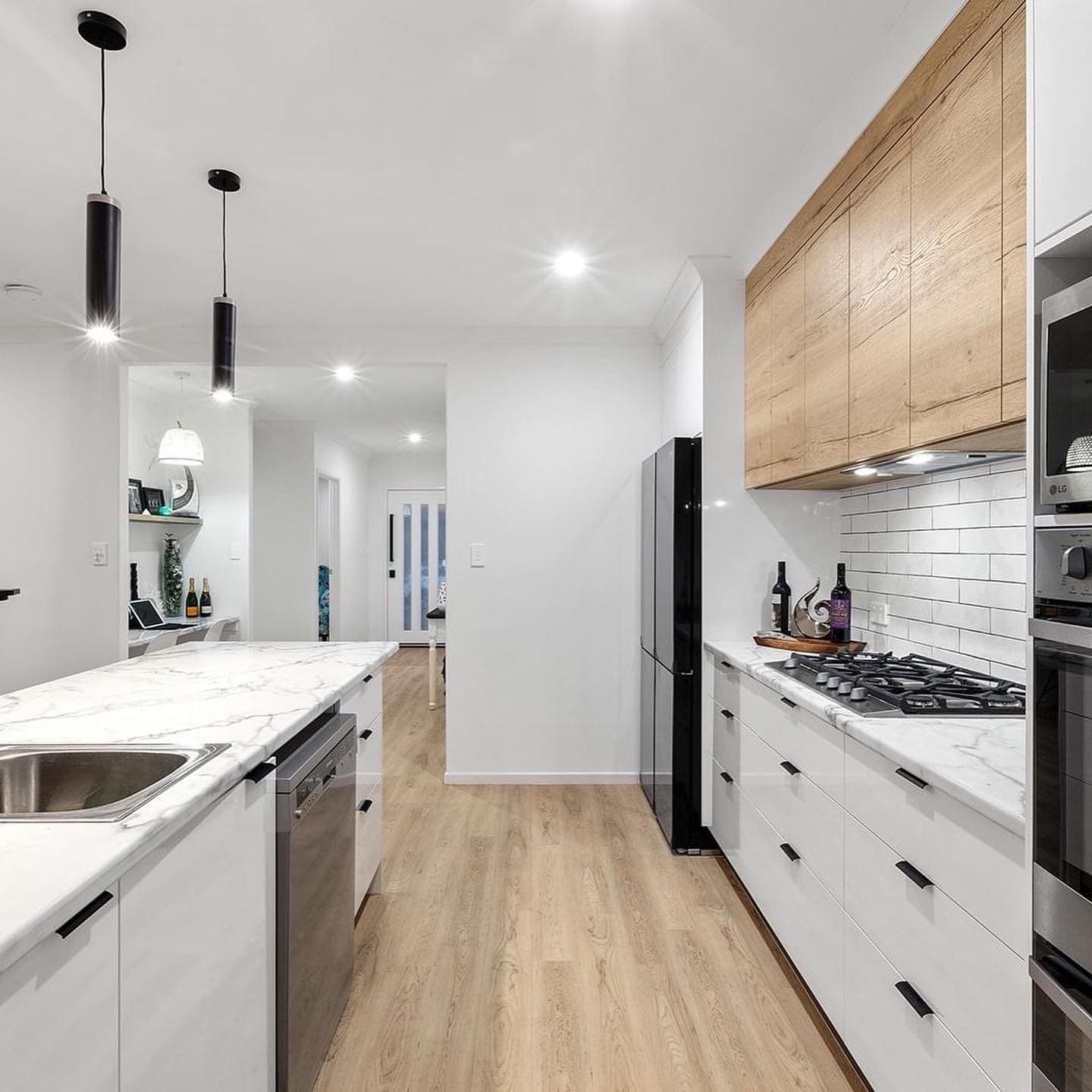 White Kitchen Interior with Wooden Accent — Keppel Kitchens in Yeppoon, QLD