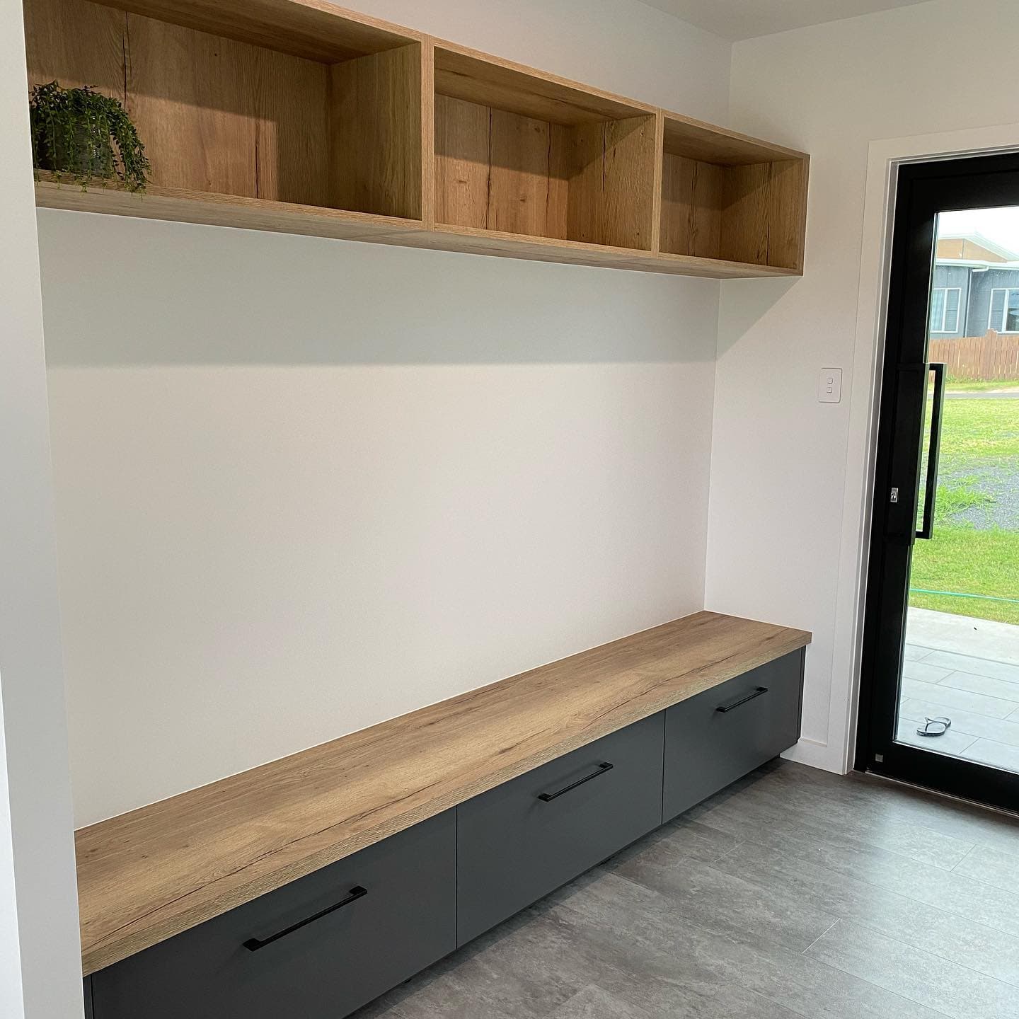 Grey Cabinets and Wall Mounted Shelves — Keppel Kitchens in Yeppoon, QLD