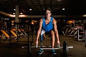 Man Lifting Weights — Pembroke Pines, FL — Huse Artificial Limb & Brace
