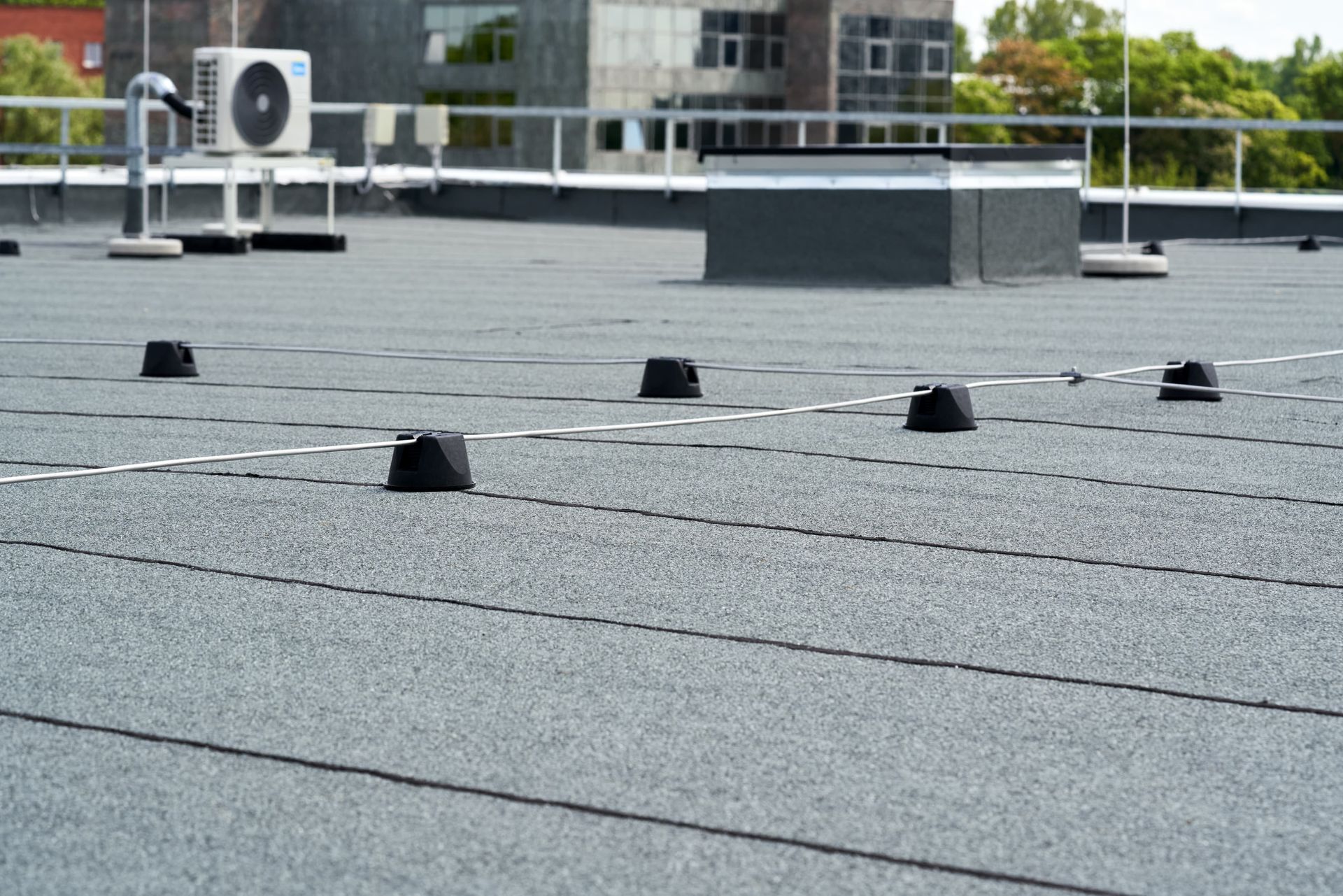 A roof with a few pieces of concrete on it