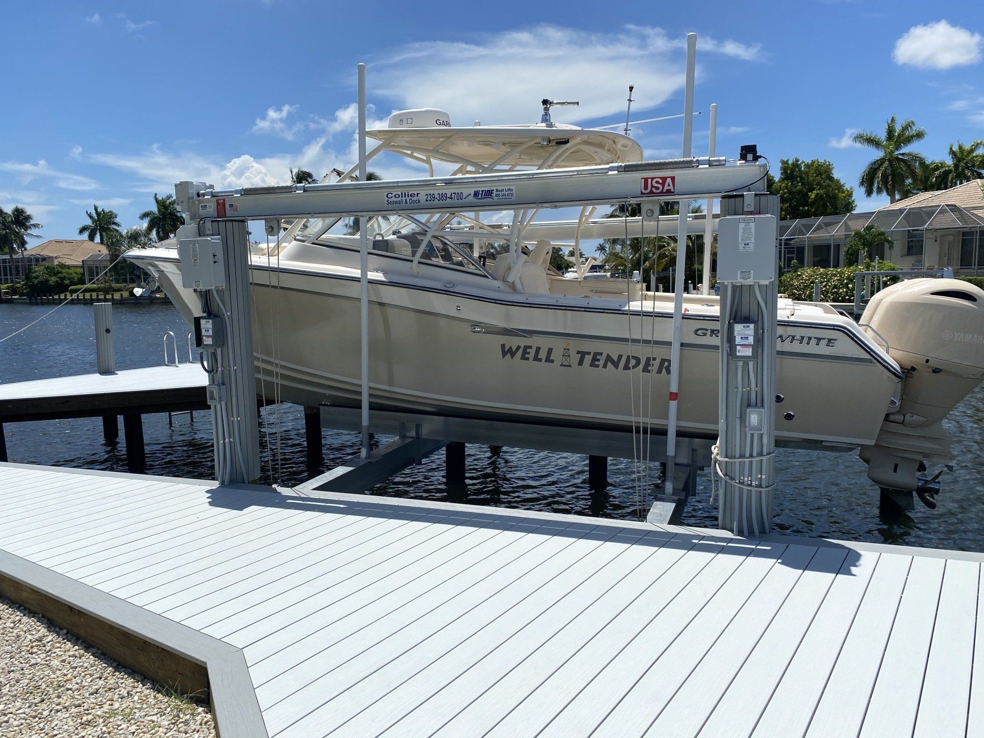 Lifted Boat — Marco Island, FL — Collier Seawall & Dock