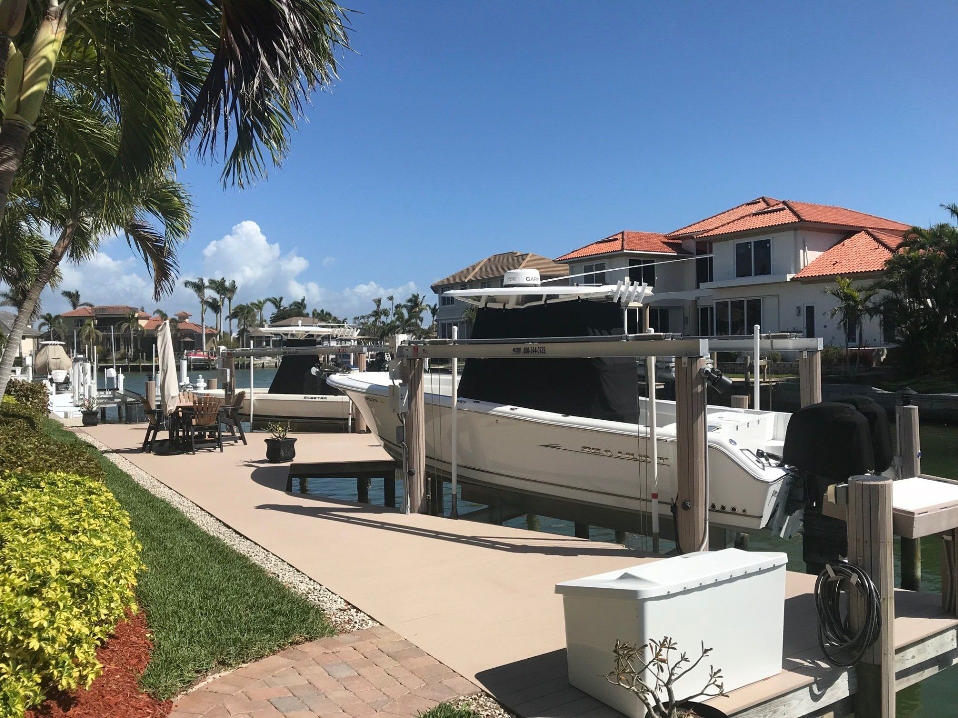 Many Decked White Boats — Marco Island, FL — Collier Seawall & Dock
