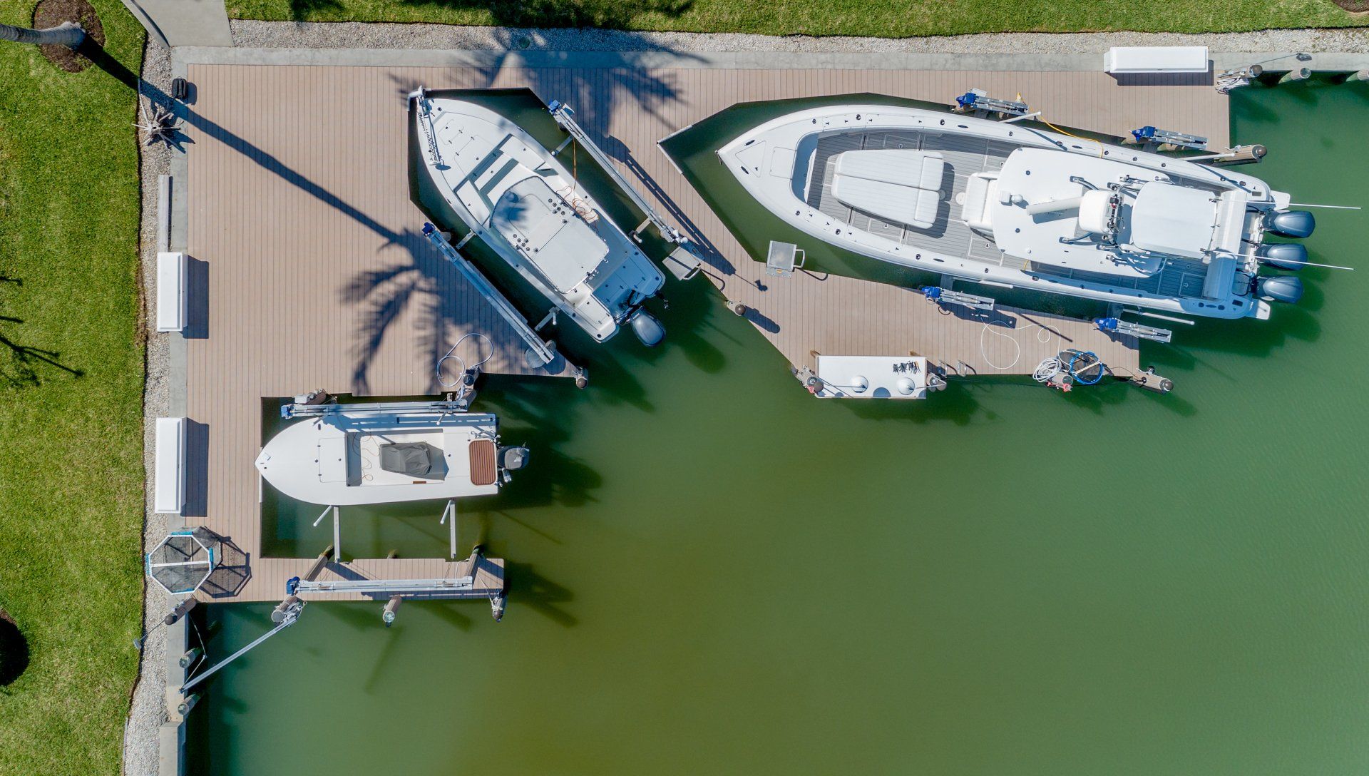 Many White Boats — Marco Island, FL — Collier Seawall & Dock