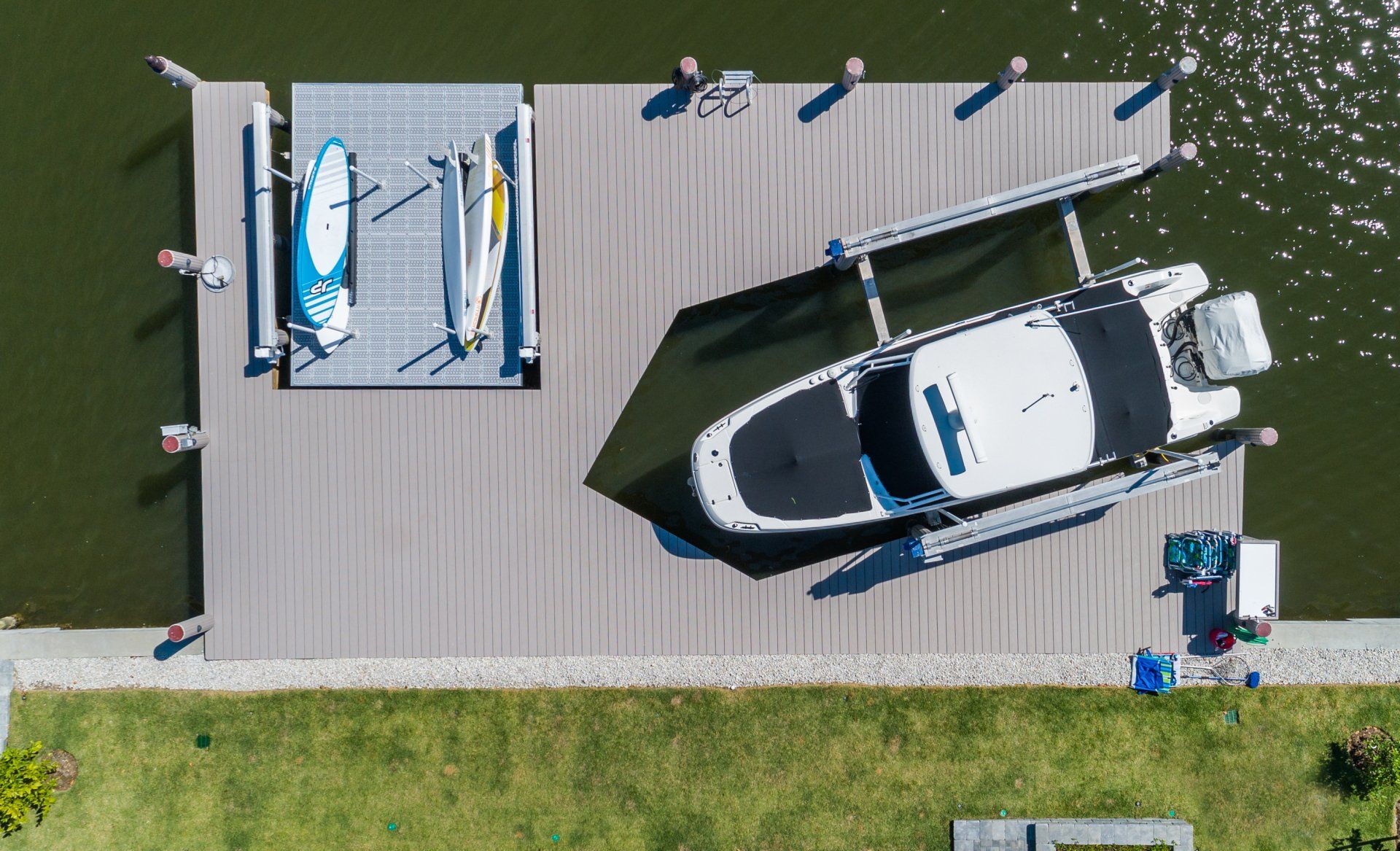 Top View of Decked White Boat — Marco Island, FL — Collier Seawall & Dock