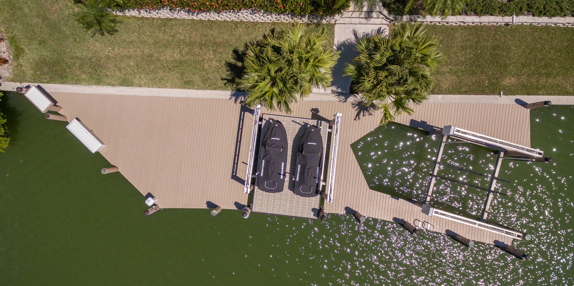 Two Covered Speed Boats — Marco Island, FL — Collier Seawall & Dock
