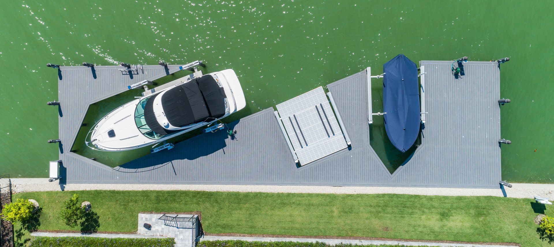 Parked Small Boat — Marco Island, FL — Collier Seawall & Dock