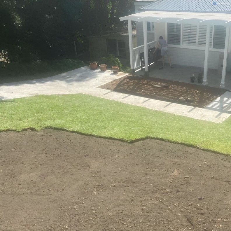 A House With a Porch and a Large Lawn in Front of It — Superior Turf in Oak Flats, NSW