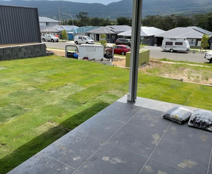 A View of a Lush Green Field From a Porch — Superior Turf in Calderwood, NSW