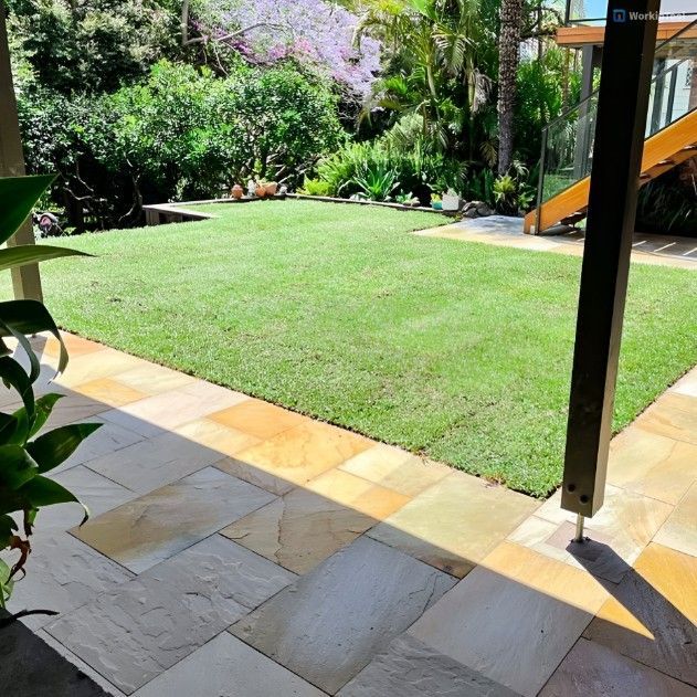 A View of a Lush Green Lawn From a Patio — Superior Turf in Oak Flats, NSW