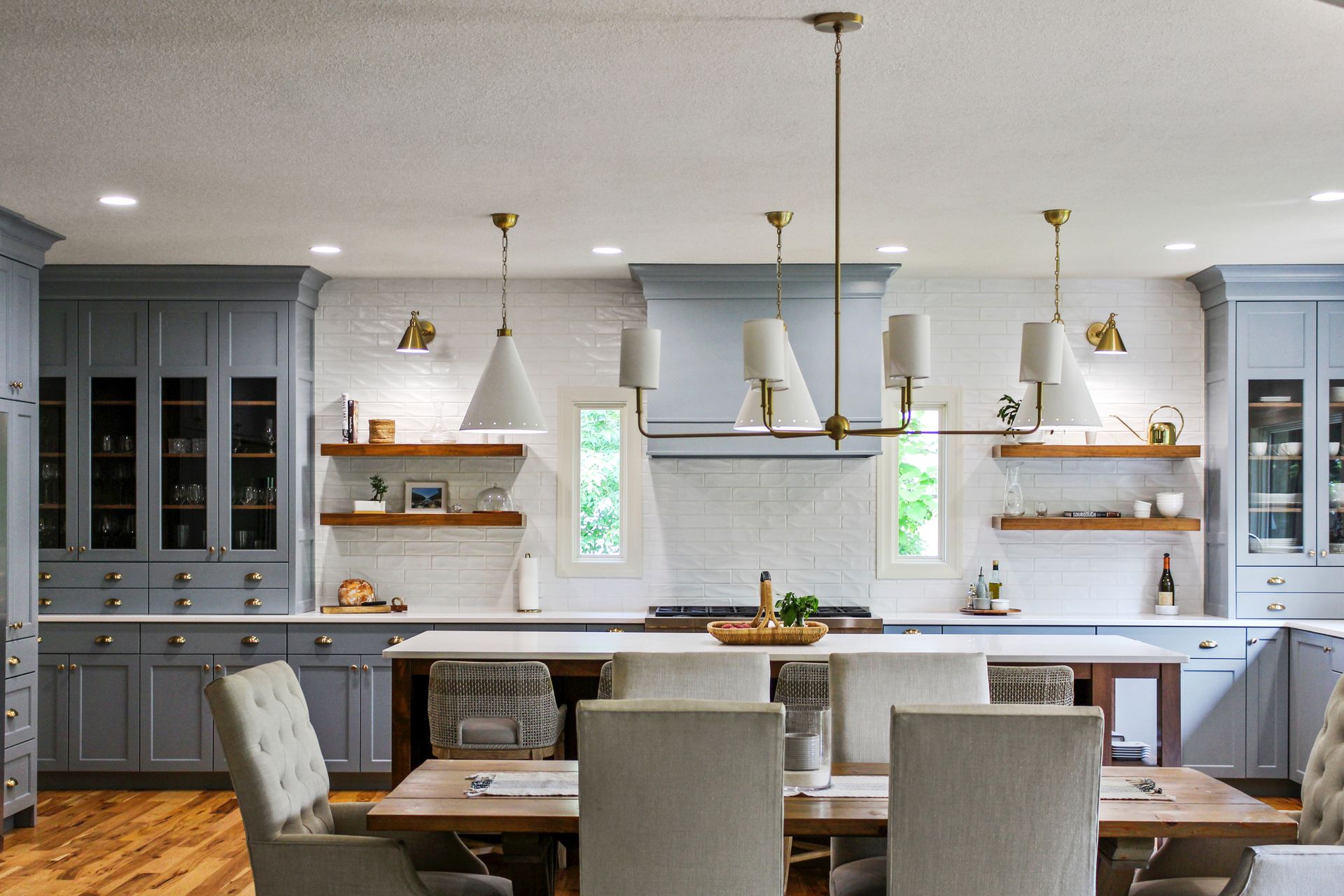 A kitchen with a table and chairs in it