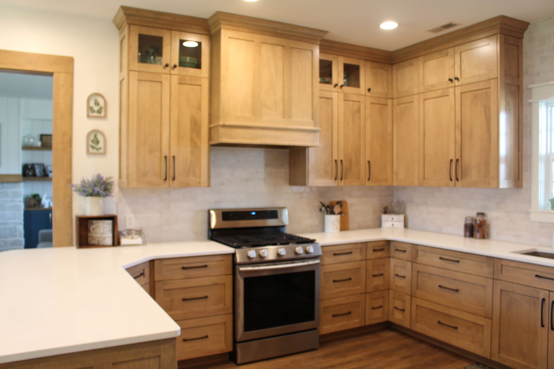 A kitchen with wooden cabinets and stainless steel appliances