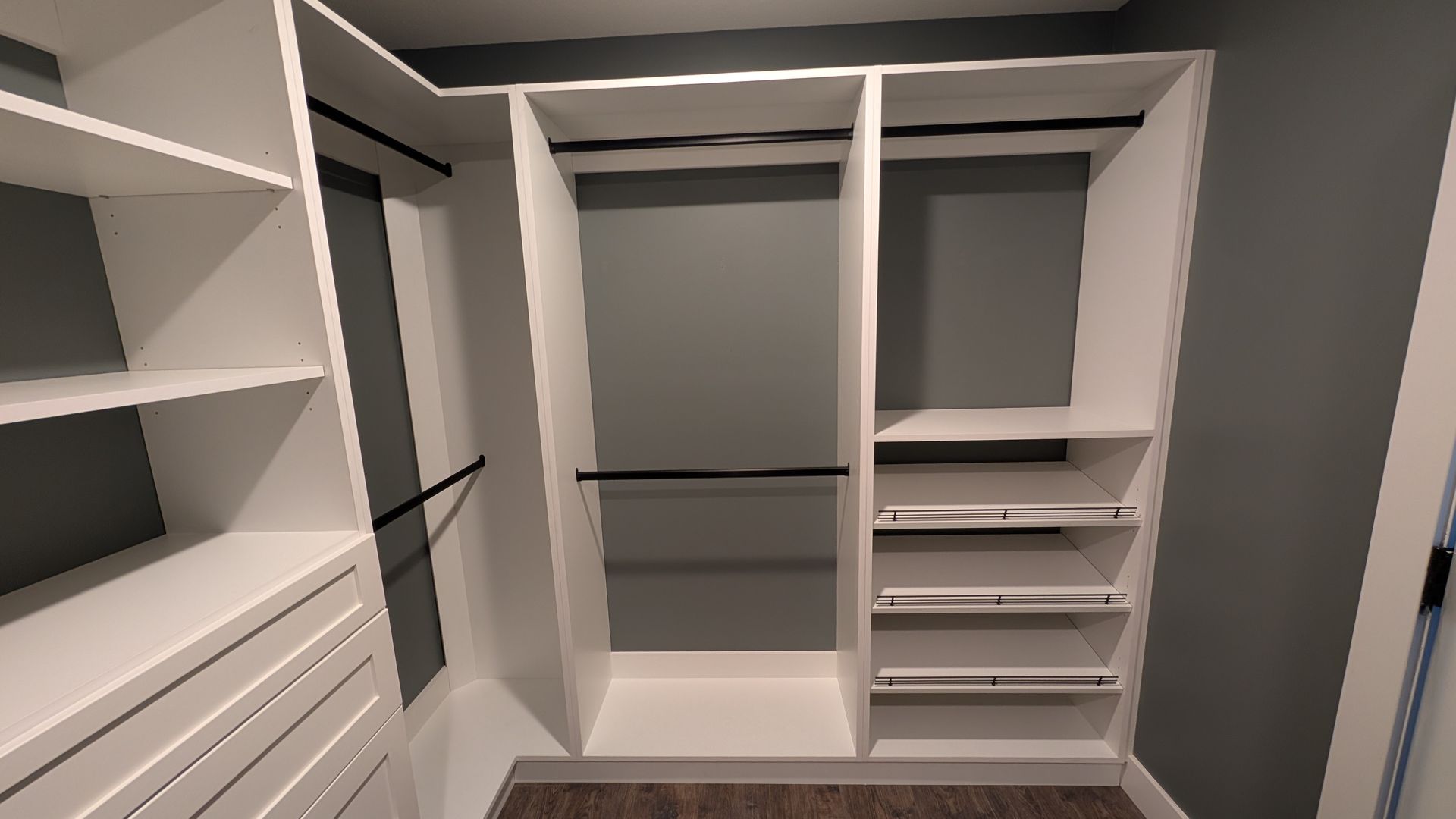 A bathroom with a sink , toilet and mirror.