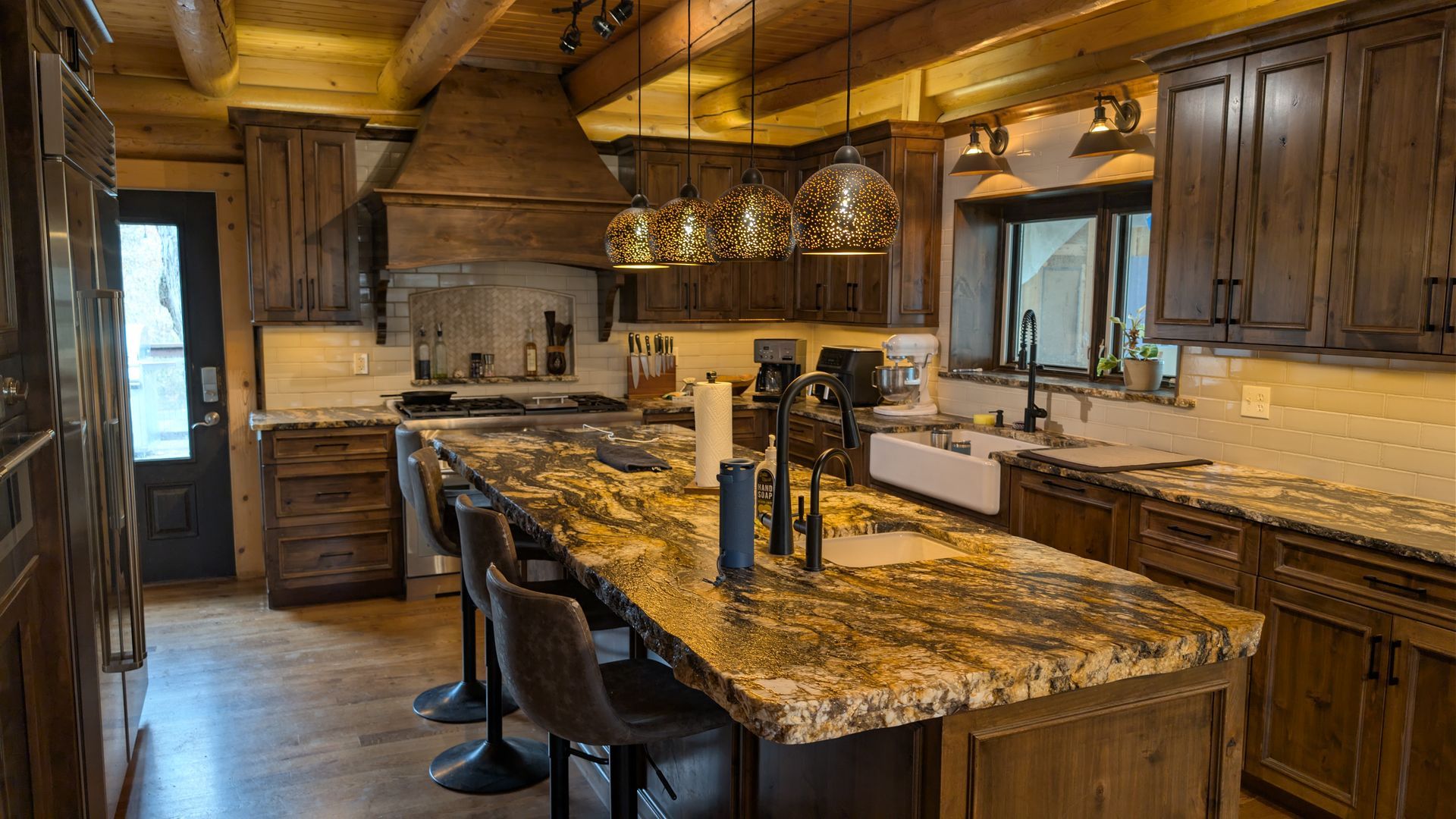 A kitchen with a table and chairs in it