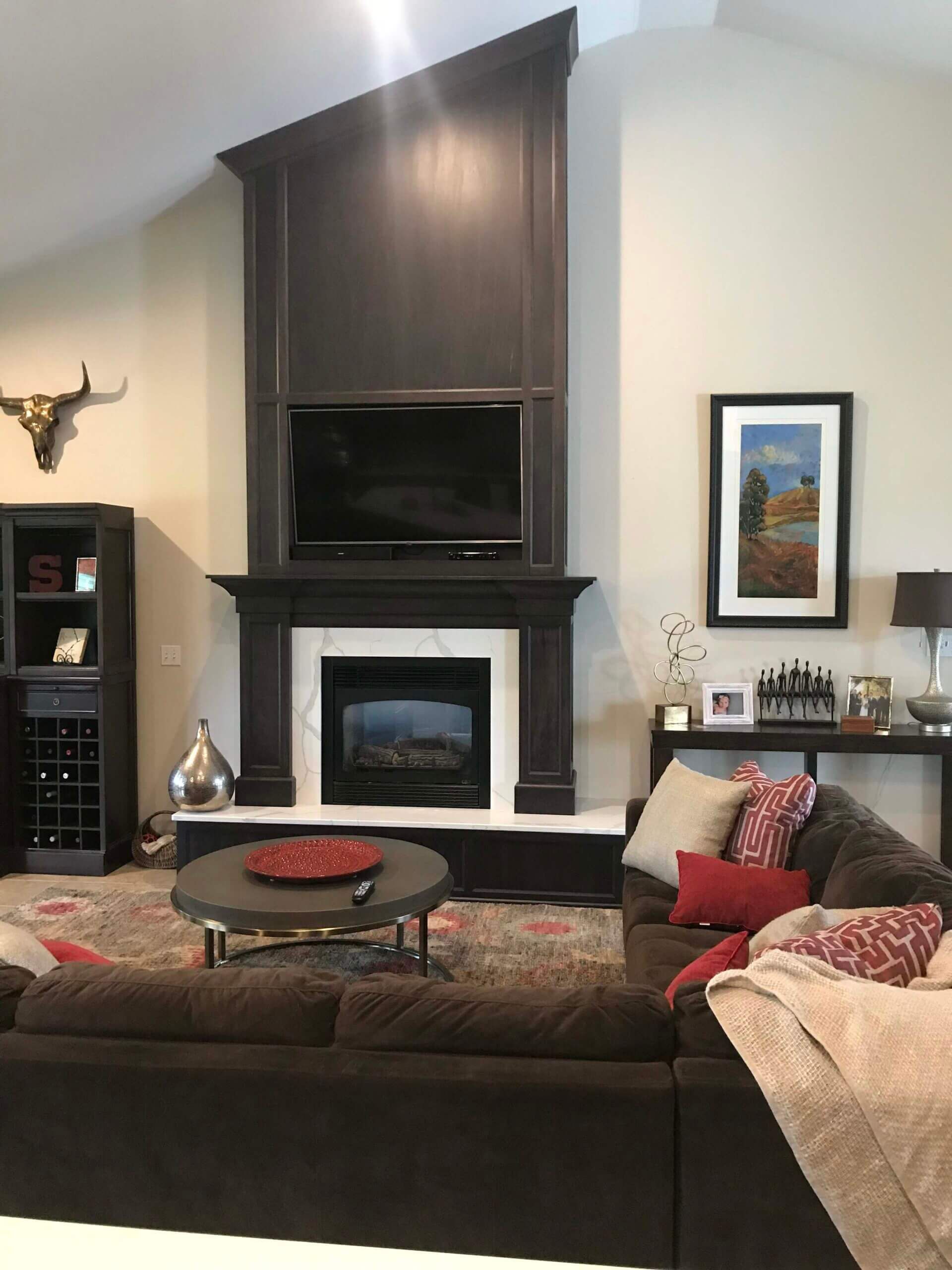 A living room with a fireplace and a couch