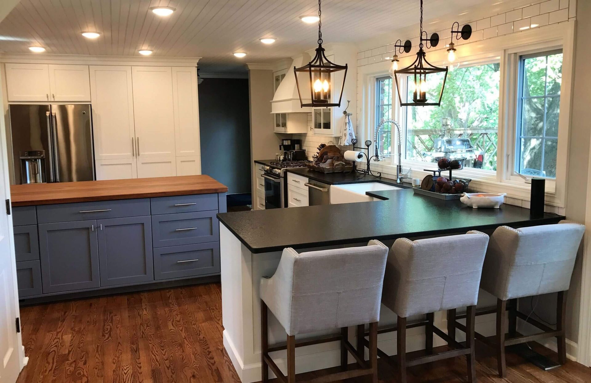A kitchen with a large island and stools