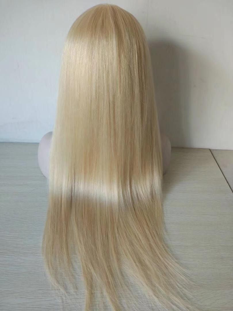 Blonde wig on a mannequin head, straight, long hair.