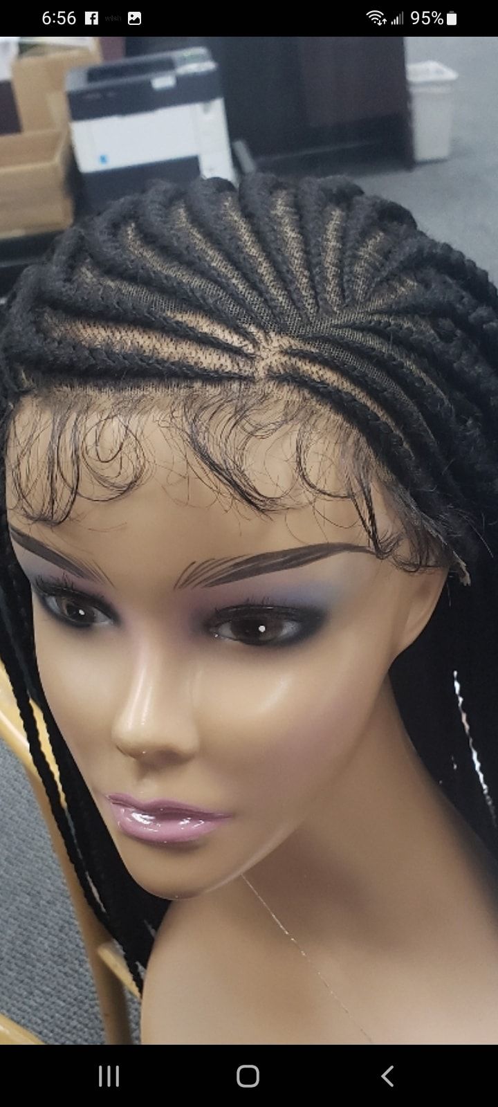 Mannequin head with cornrow braids and lace front.