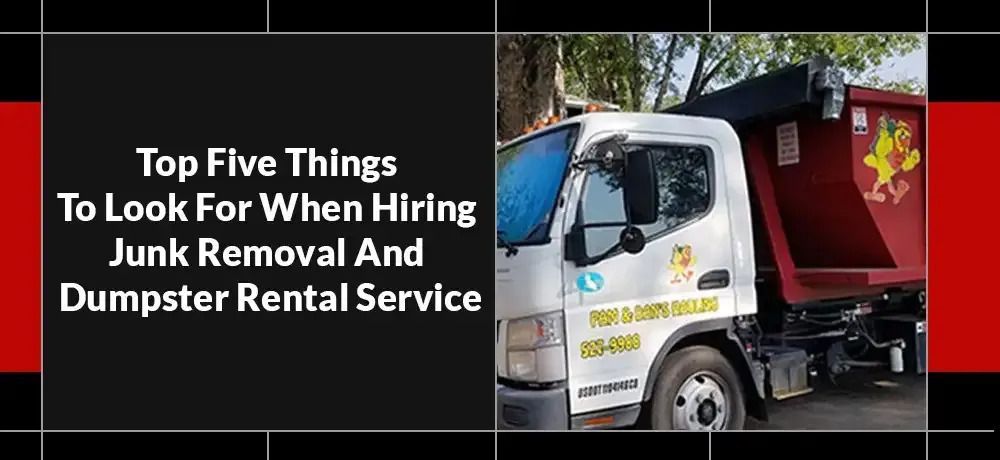 A dumpster rental service truck is parked in front of a tree.