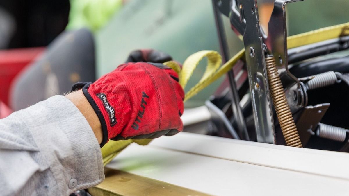A red dumpster from pam and dan 's hauling