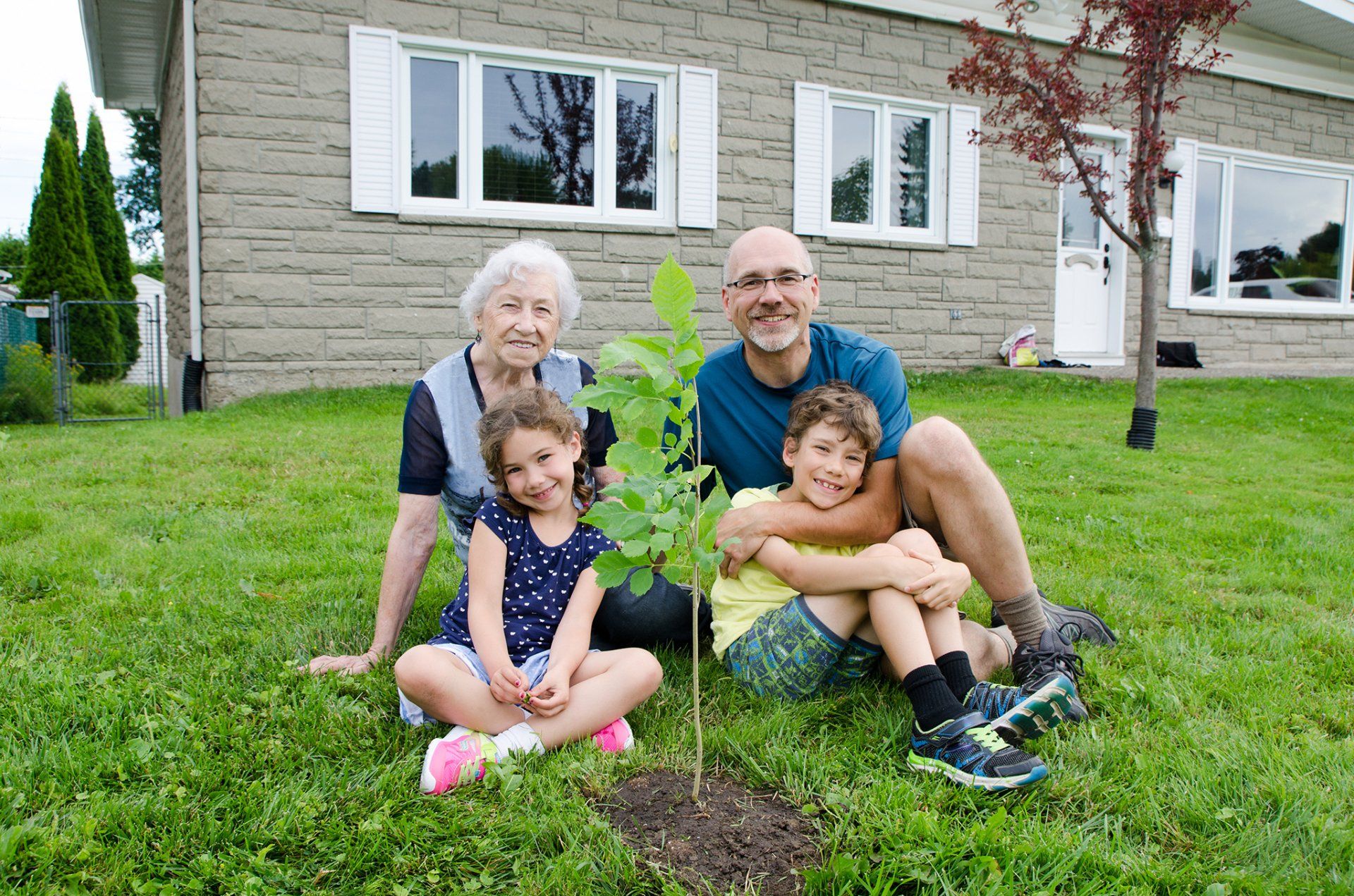 family planting tree