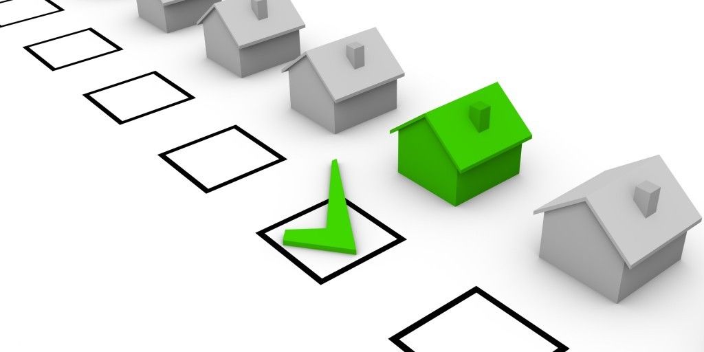 A checklist with houses and a green check mark