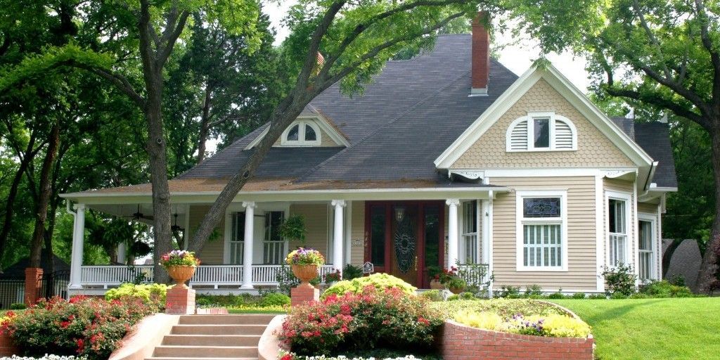 A house with a porch and stairs leading up to it