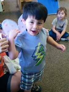 A young boy wearing a shirt with a lightning bolt on it