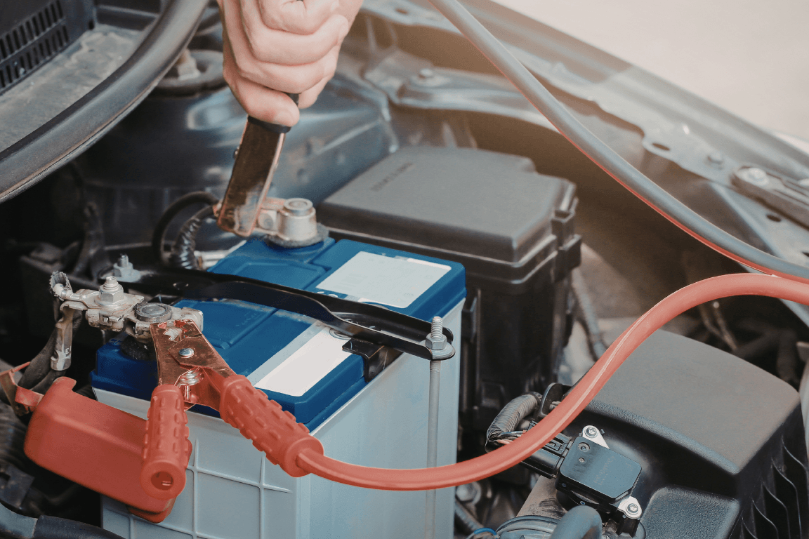 a mechanic fixing a car battery