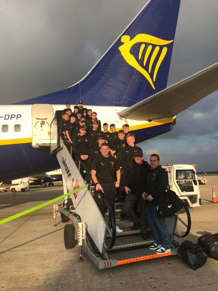 A group of people are boarding a ryanair plane