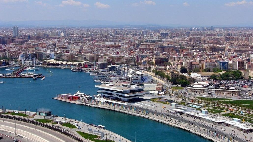 An aerial view of a large body of water surrounded by buildings and a city.