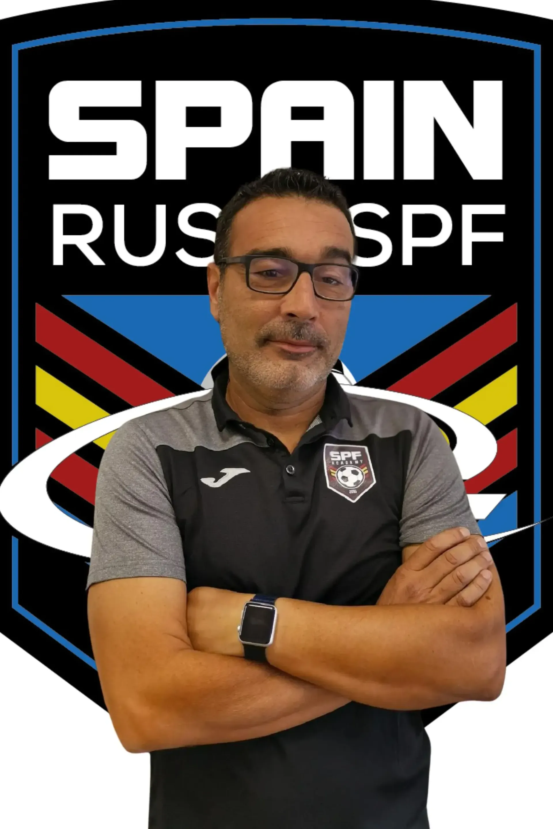 Carlos de Lera wearing glasses is standing in front of a  Spain Rush-SPF logo