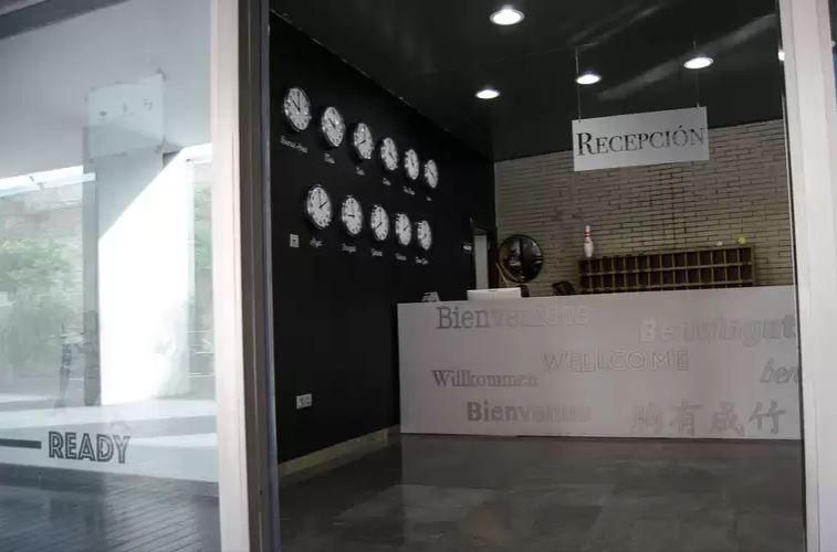 A reception area with a sign that says ' ready ' on it