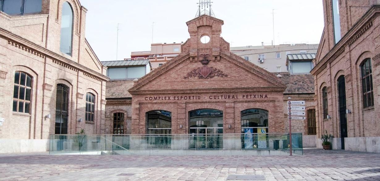 A brick building with a clock tower on top of it.