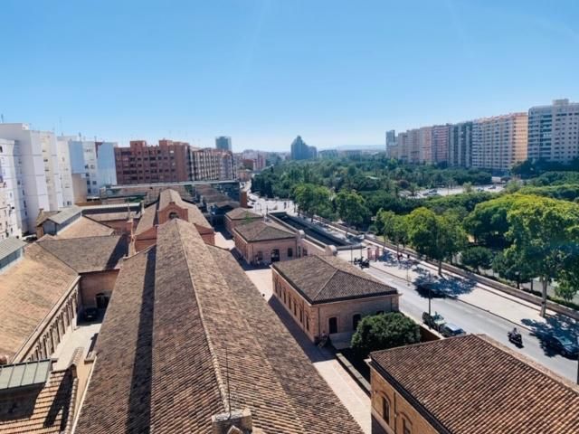 An aerial view of a city with lots of buildings and trees