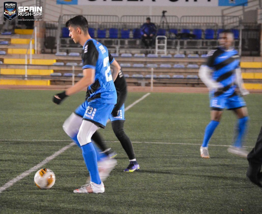 A soccer player with the number 12 on his jersey