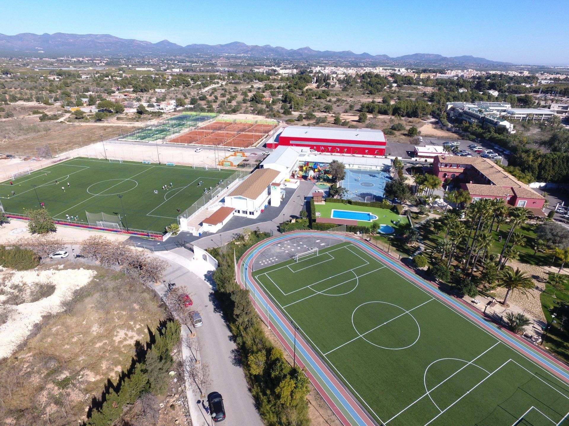 An aerial view of the Spain Rush-SPF soccer field and a track.