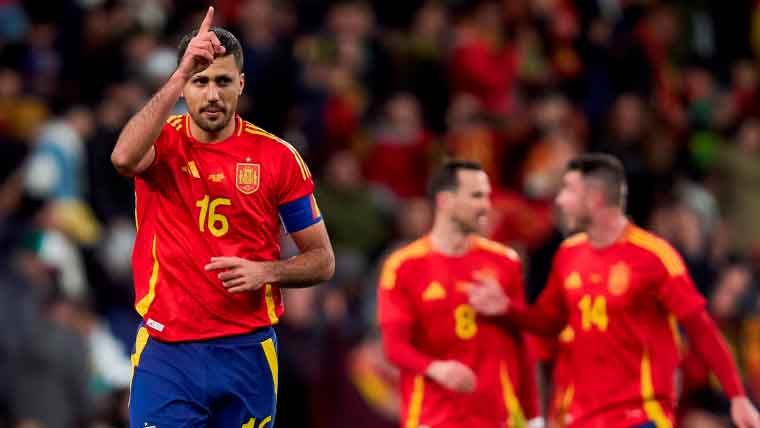 Spain Men's National Soccer Team standing on a field in red jerseys