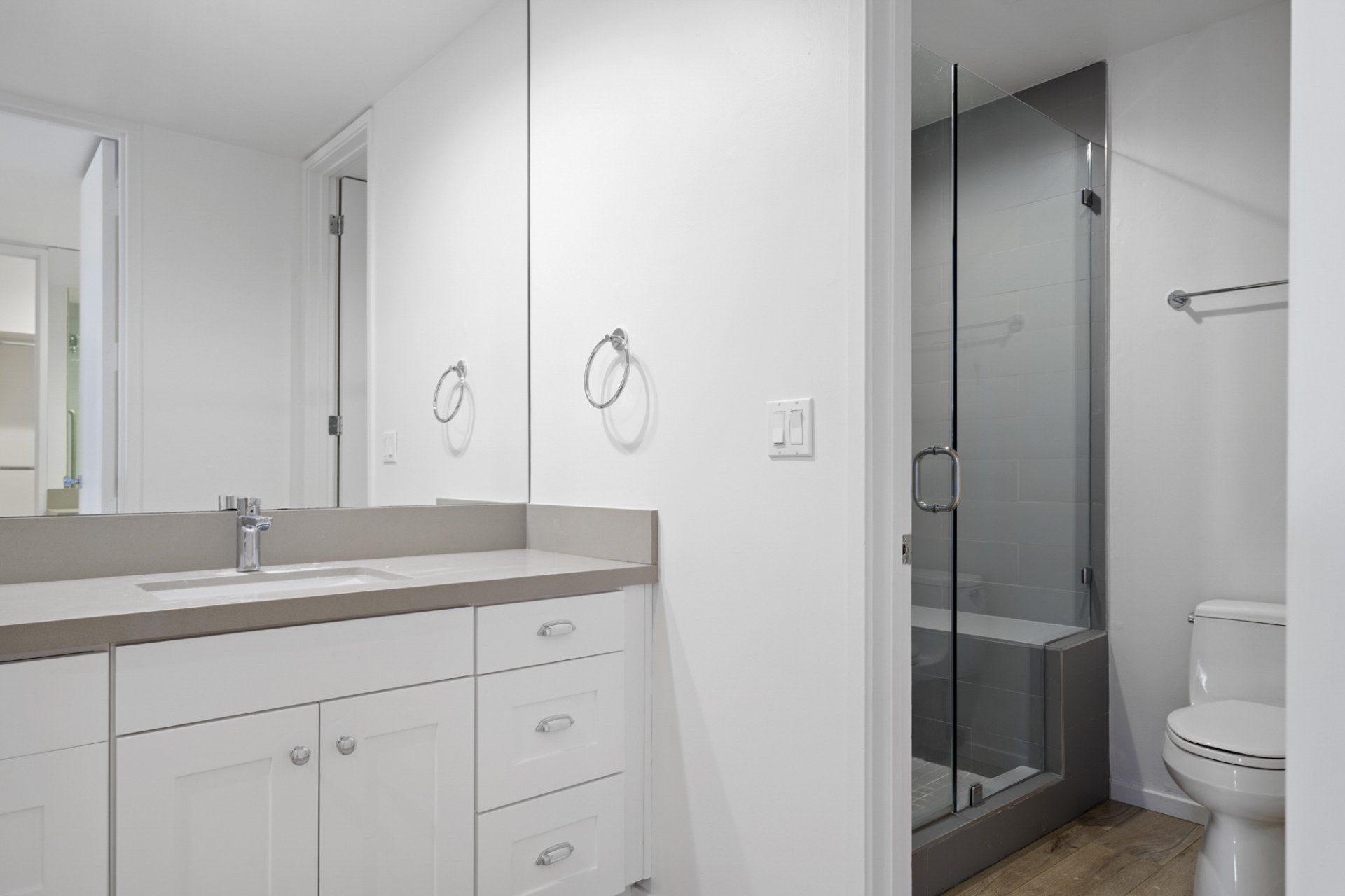 Interior view of large bathroom with shower and sink