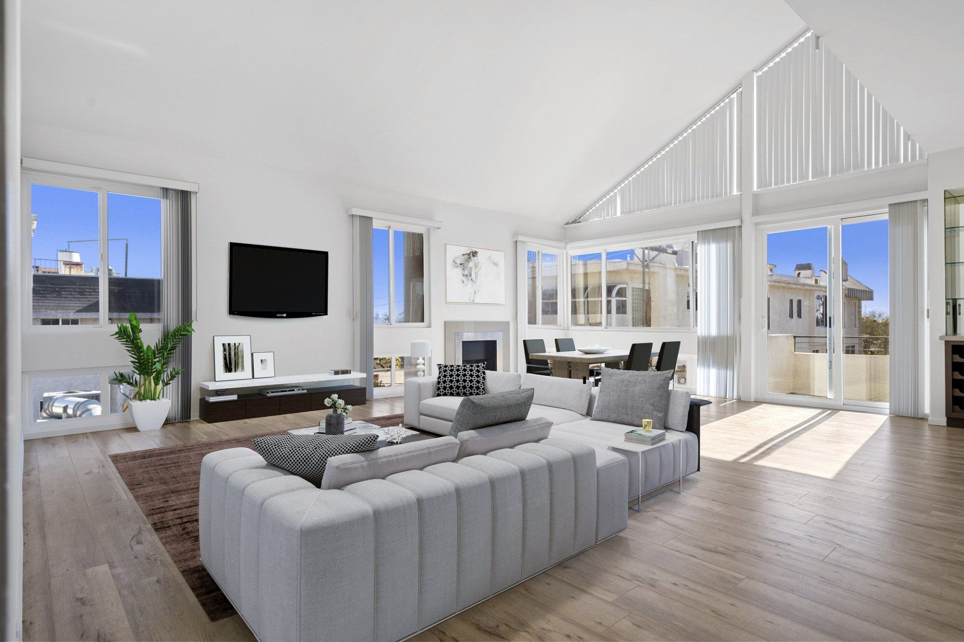 Interior of living room with open layout and large windows surrounding