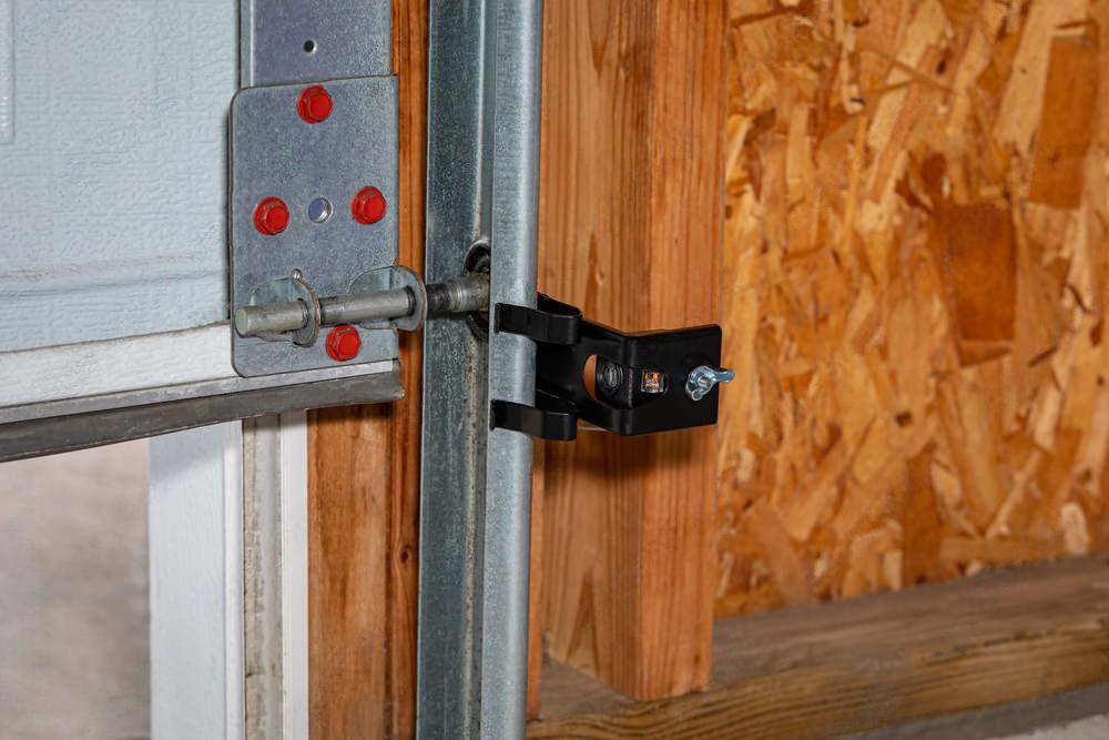 a close up of a garage door with a latch on it .