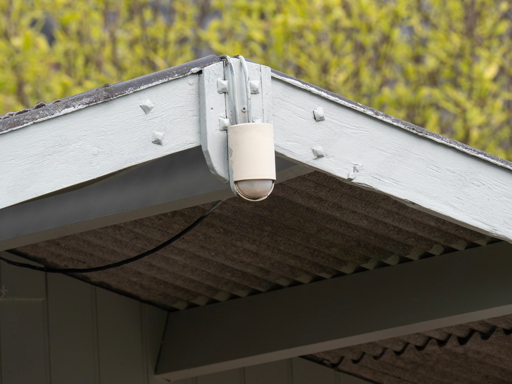 a security camera is mounted on the roof of a building