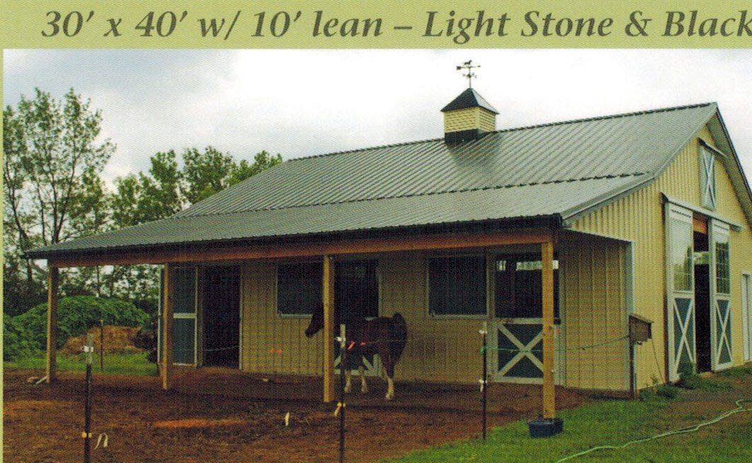 A light stone and black barn with a 10-foot lean-to; a horse stands inside.