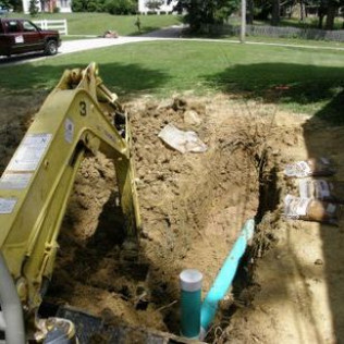 A yellow excavator with the number 3 on it