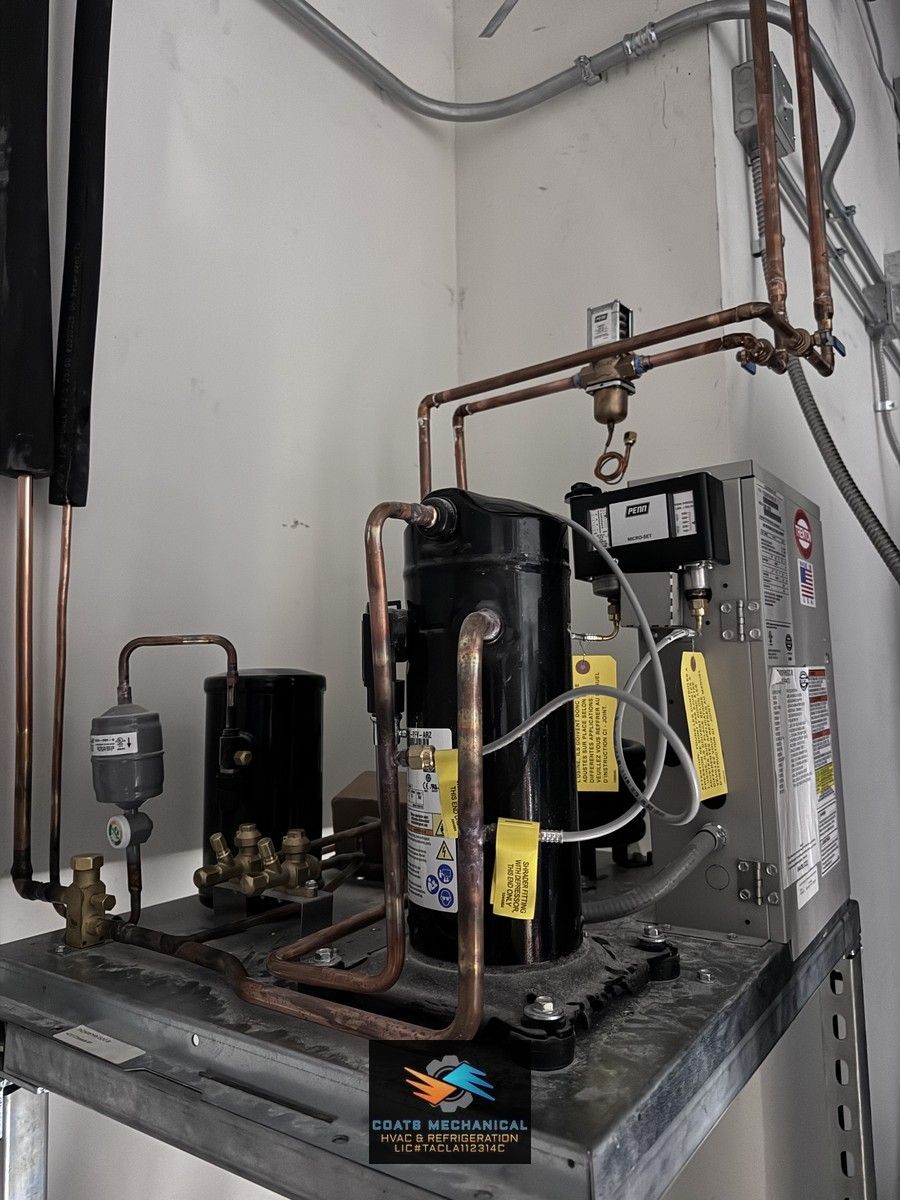 A commercial refrigeration compressor, installed with care and ready to keep things running cool!